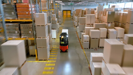 In a busy cargo warehouse, a forklift operator maneuvers through towering box stacks, symbolizing global supply chains. Each pallet signifies a journey from production to consumer.