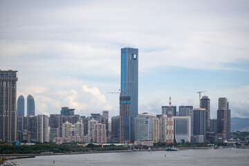 China Xiamen The Skyline of a Modern City with Towering Skyscrapers and a Calm Waterfront