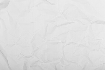 Wrinkled white paper surface with natural creases and soft shadows, ideal for backgrounds, mockups,...