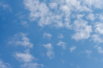 Blue Sky with Clouds and Contrail