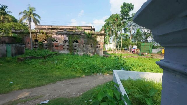Editorial Pan of Mossy Wall and Greenery Behind Zamindar House in Laksam, Cumilla, Bangladesh on 13 June 2025