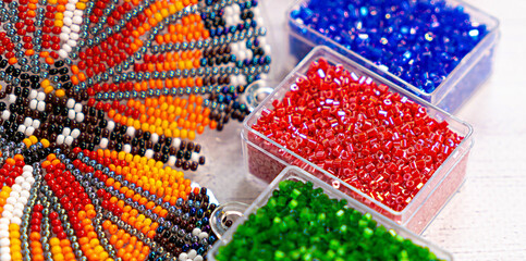 Colorful glass beads. Variety of shapes and colors to make a bead necklace or a string of beads for women