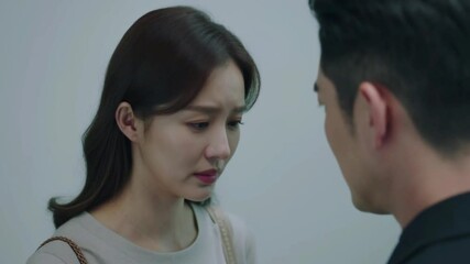 Tension dissolves as two people collapse into an embrace, their anger fading into warmth and human connection in a cinematic moment of emotional release