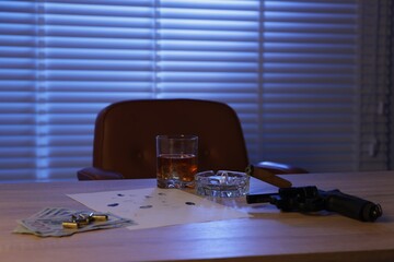 Mafia and criminal world. Gun, cigar, whiskey, fingerprints, money and bullets on wooden table...
