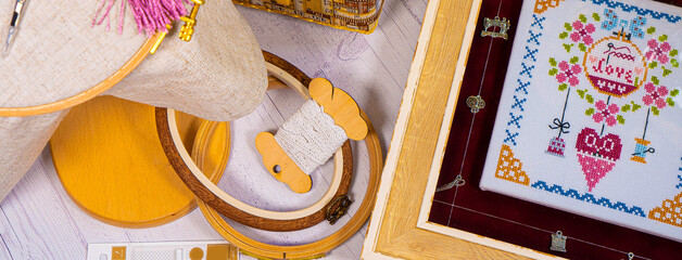Accessories for hobby. Hoop snaps, scissors, threads, needles and scissors. Vintage tools for embroidery and knitting
