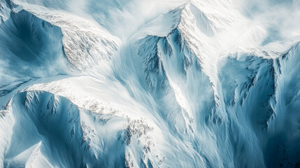 An abstract top-down view showcases the beauty of snow-covered mountain ridges, where deep shadows play against shimmering sunlight, creating a mesmerizing winter landscape