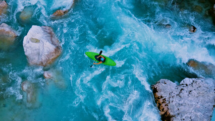 Drone captures a kayaker battling turquoise rapids, showcasing courage and nature's power.