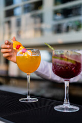 Bartender mixing and serving cocktails