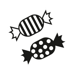 Two black candies with white patterns candy sweet