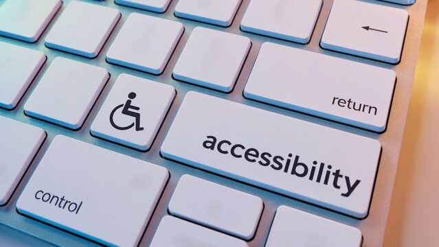 Close-up of computer keyboard with accessibility key and wheelchair icon, symbolizing inclusive technology, digital access, and assistive design for users with disabilities. - Powered by Adobe