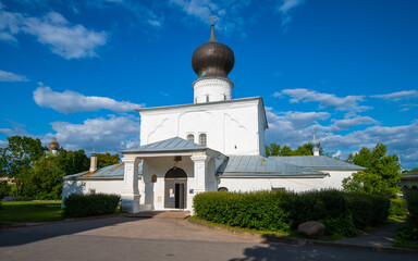 Facade Russian Orthodox Church of the Assumption with Paromenya with a belfry on the banks of the Great River, Pskov, Russia.