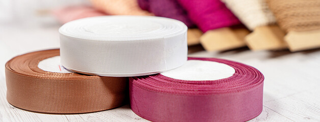 Colored ribbons and lace in coils for hobbies