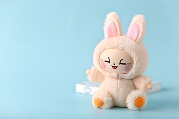 Adorable Beige Bunny Plush Toy on Light Blue Background