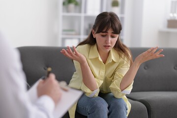 Professional psychologist working with patient in office, selective focus