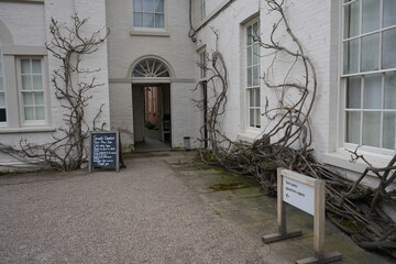 Shugborough, Staffordshire, England - February 24 2024: Entrance to historic servants quarters with...