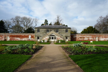 Shugborough, Staffordshire, England - February 24 2024: Historic walled garden pavilion capturing the essence of winter sunlight.