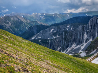 landscape with sunlit diagonal green mountainside