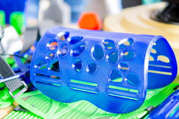 Medical splint for hand treatment. Medical splint printed on 3D printer from molten plastic. Model...