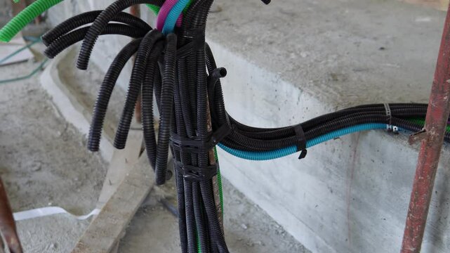 Electrical wiring in corrugated plastic pipes. Pipes are part of electrical installation works for the infrastructure of buildings, engineering systems and processes of the construction industry.