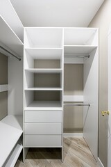 Fototapeta premium well-lit, open white closet with shelves, drawers, and hanging rods. The interior is beige. Parquet flooring is visible at the bottom