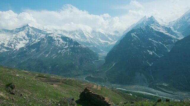 4K aerial shot of Indian Girl running uphill with emotions of joy and sense of satisfaction. Girl on top of the mountain celebrating summit. The concept of achieving success. Happy and drunk on life.