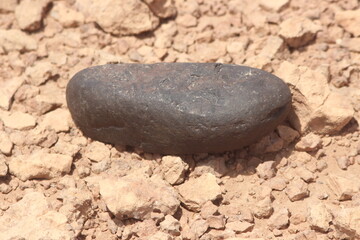 A black stone on the ground