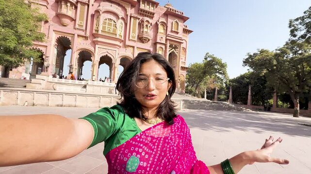 4K Selfie vlog of teenager Indian girl vlogging at Patrika gate in Jaipur, Rajasthan, India. Tourist wearing traditional saree and exploring architectural monuments. Girl recording at Patrika Gate.