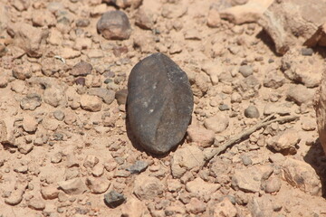 A black stone on the ground