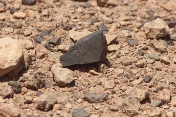 A black stone on the ground