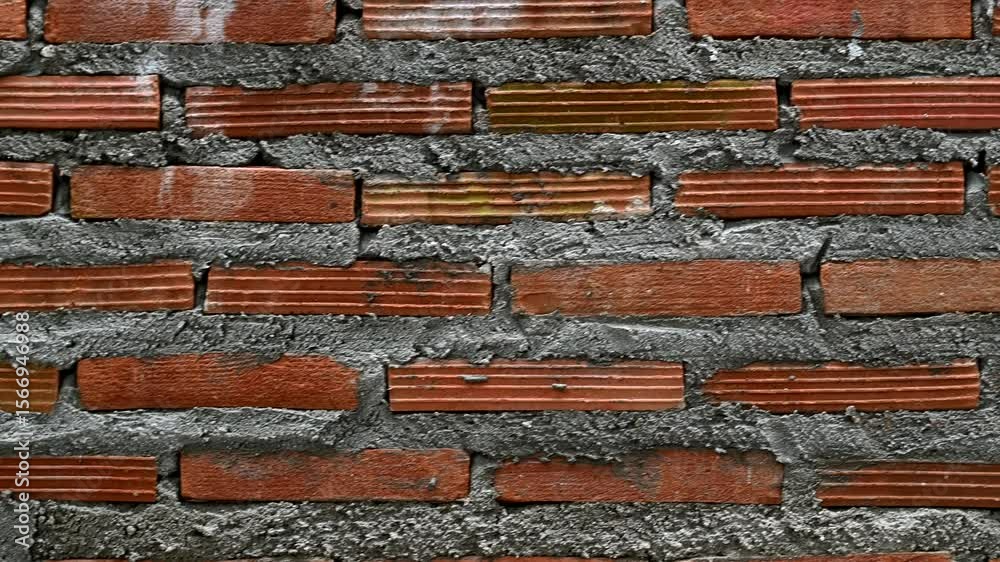 Poster detailed red brick wall construction with rough surface texture. masonry pattern and messy mortar cr