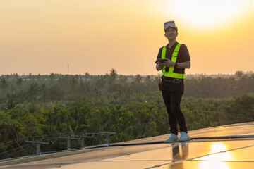 Technology solar cell Engineer service check installation solar cell on the roof of factory....