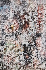 The plaster is applied to the wall in uneven layers. Smudges or splashes of paint