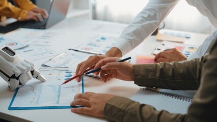 A dynamic business meeting featuring teamwork and collaboration focused on data analysis and...