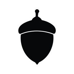 Isolated black acorn on white background, a symbol of autumn harvest