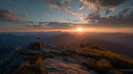 Sunset over mountain range scenic landscape with golden light and clouds