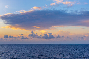 Sunset with sea. Colorful majestic scenery sunset sky with amazing clouds and waves. Beautiful sunset over sea landscape