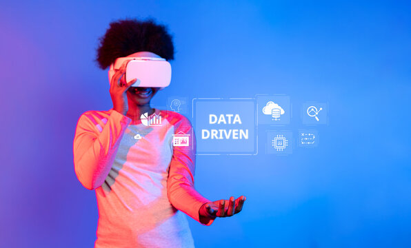 A vibrant depiction of a young woman using a VR headset, exemplifying data-driven analytics and visualization concepts in technology. Ideal for digital innovation themes. XDMCP