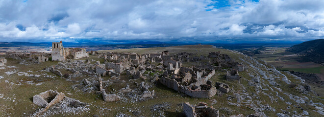 Aerial view from a drone of the deserted and ruined village of Peñalcazar in the Campo de Gómara region. Soria province. Castile and León. Spain. Europe.