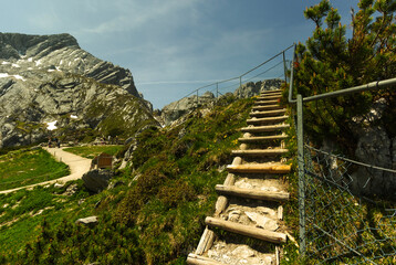 A simple staircase without a handrail in the mountains view from bottom to top
