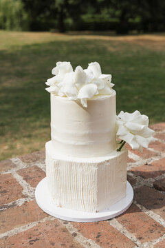 modern white wedding cake with flowers