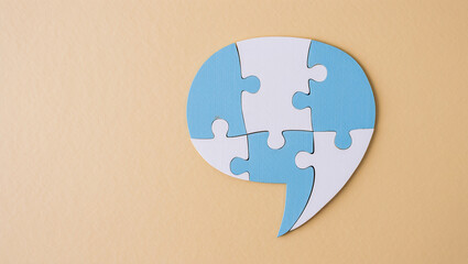 Speech bubble made of interlocking puzzle pieces, symbolizing teamwork, problem-solving, and collaboration-ideal for corporate, education, and communication themes.