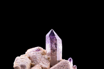 Amethyst, on microcline. Specimen from Erongo region, Namibia. macro photography detail texture background. close-up mineral crystal unpolished semi-precious gemstone