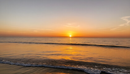 Golden Sunset Over Calm Ocean with Clear Orange Sky &ndash; Tranquil Seascape