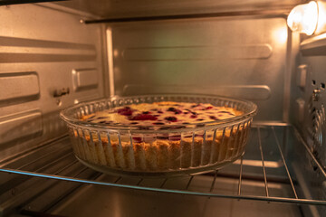 Berry Pie Baking: Daytime oven bakes homemade dessert for enjoyment in kitchen.