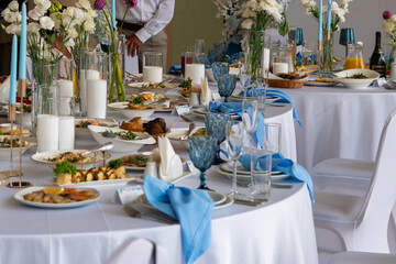 Table setting, event, flowers. Elegant feast with decorations on table at the indoor event place for celebration.