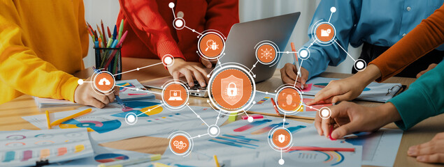 A diverse group of professionals collaborate on cybersecurity strategies, surrounded by colorful...