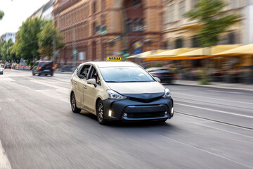 Taxi speeding through city. Motion blur. Urban transport concept
