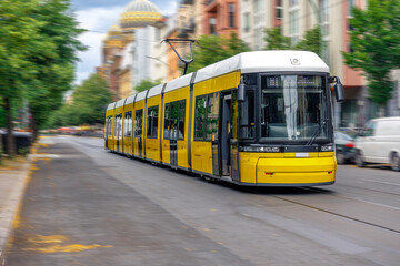 Long tram on Berlin street. Urban transport. Historical city style