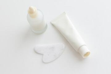 Minimal Skincare Flat Lay with Dropper Bottle and Face Tools