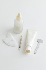 Minimal Skincare Flat Lay with Dropper Bottle and Face Tools